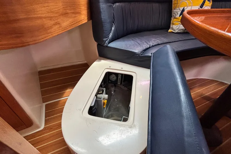  Yacht Photos Pics Interior of 2006 Catalina 42 MkII sailboat with open storage compartment.