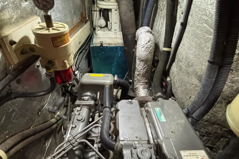  Yacht Photos Pics Engine room of a 2006 Catalina 42 MkII sailboat, showing mechanical components and wiring.