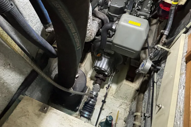  Yacht Photos Pics Engine compartment of a 2006 Catalina 42 MkII sailboat, showing mechanical components and hoses.