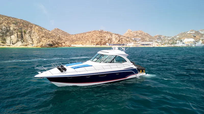 Baja 22 With Dry Storage In Cabo San Lucas Yacht Photos Pics 2007 Formula 45 Yacht cruising on blue ocean near rocky coastline.