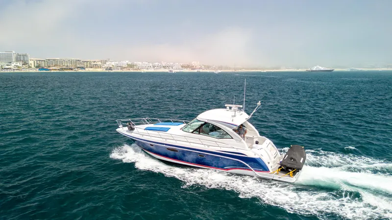 Baja 22 With Dry Storage In Cabo San Lucas Yacht Photos Pics 2007 Formula 45 Yacht cruising on open water near a coastal city.