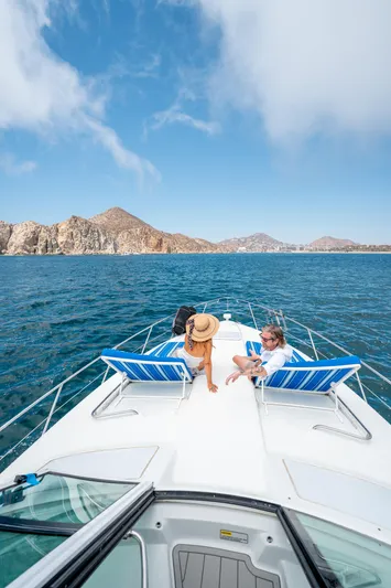 Baja 22 With Dry Storage In Cabo San Lucas Yacht Photos Pics 2007 Formula 45 Yacht cruising with passengers, scenic ocean view, clear blue sky.