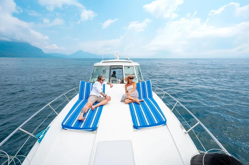 Baja 22 With Dry Storage In Cabo San Lucas Yacht Photos Pics 2007 Formula 45 Yacht with people relaxing on deck, ocean view, blue sky.