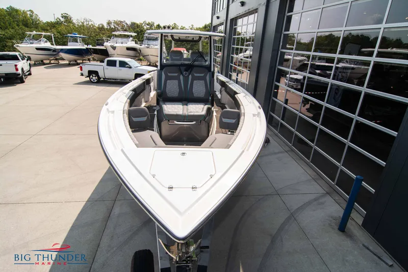  Yacht Photos Pics 2022 Fountain 32 NX boat displayed outside a showroom.