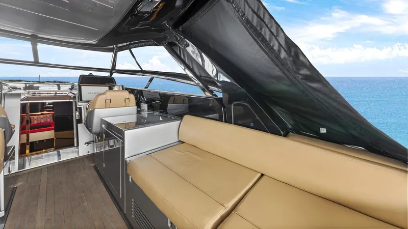 Wegu The Great Yacht Photos Pics 2023 Riva Dolceriva yacht interior with beige seating and ocean view.