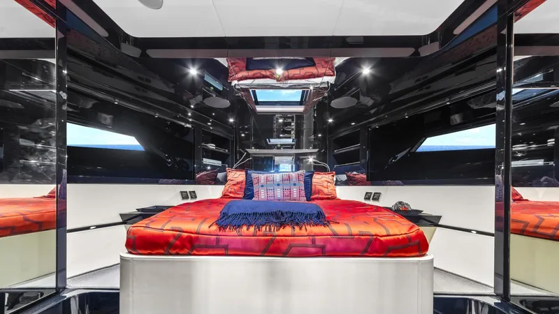 Wegu The Great Yacht Photos Pics Luxurious 2023 Riva Dolceriva yacht interior with modern bedroom design and vibrant red bedding.