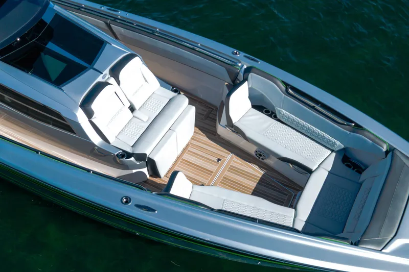  Yacht Photos Pics 2024 Nor-Tech 500 Sport Center Console with luxurious seating and sleek design on water.