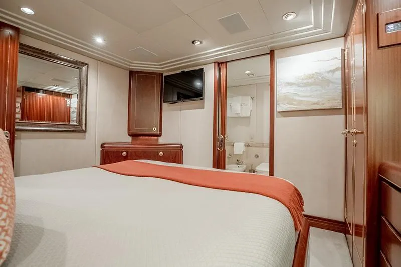 Never Enough Yacht Photos Pics Luxurious bedroom on a 1992 Feadship 140 Tri-Deck yacht with ensuite bathroom.