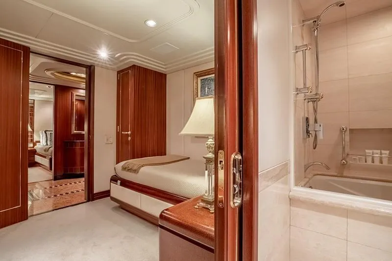 Never Enough Yacht Photos Pics Luxurious bedroom and bathroom on a 1992 Feadship 140 Tri-Deck yacht.