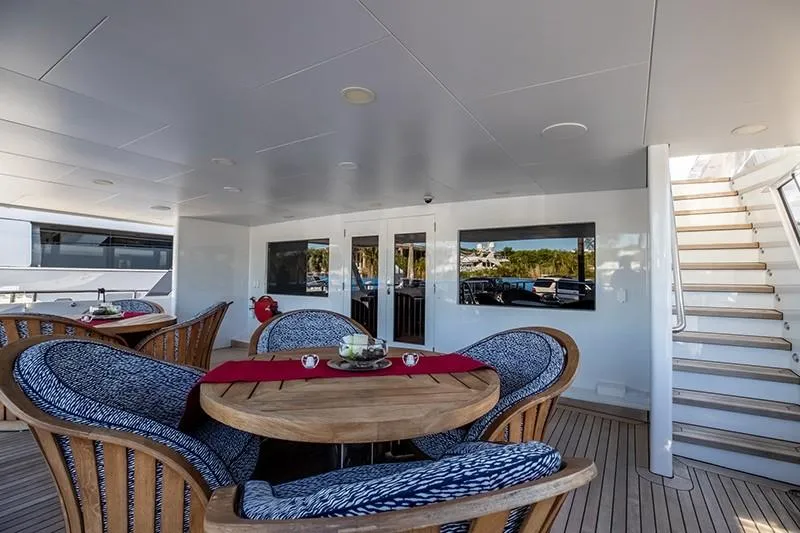 Never Enough Yacht Photos Pics Luxurious outdoor dining area on 1992 Feadship 140 Tri-Deck yacht.