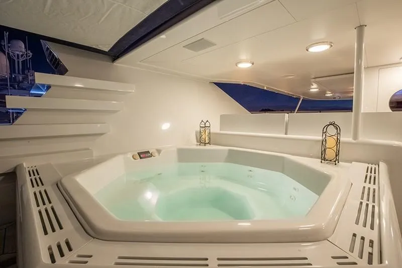 Never Enough Yacht Photos Pics Luxurious hot tub on the 1992 Feadship 140 Tri-Deck yacht.