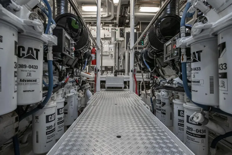 Never Enough Yacht Photos Pics Engine room of 1992 Feadship 140 Tri-Deck yacht with CAT machinery.