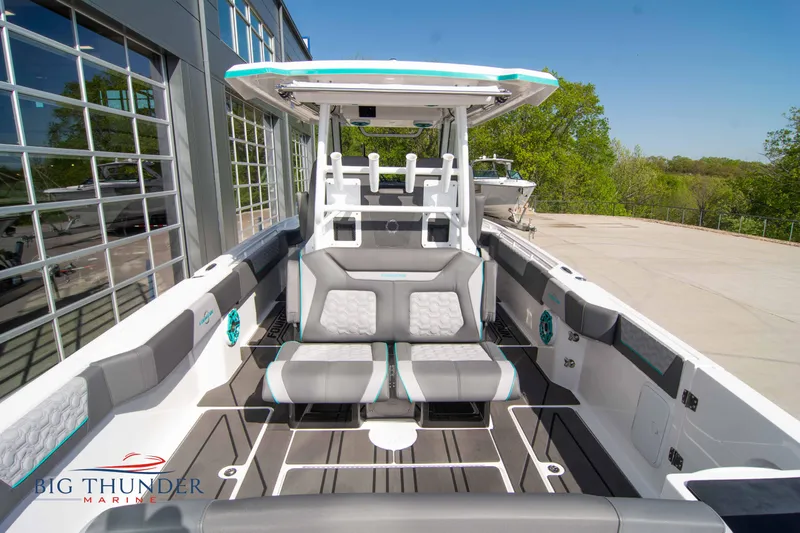  Yacht Photos Pics Interior view of a 2022 Fountain 32 NX boat, gray seating, modern design.