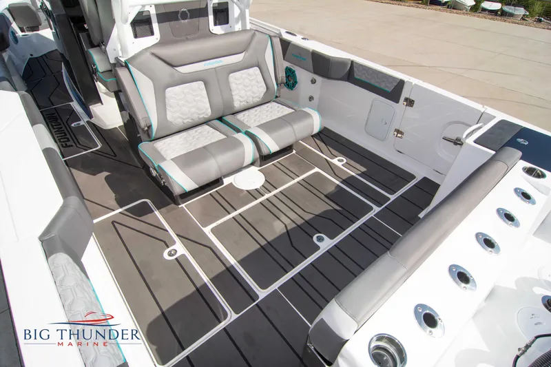  Yacht Photos Pics Interior of a 2022 Fountain 32 NX boat with gray seating.