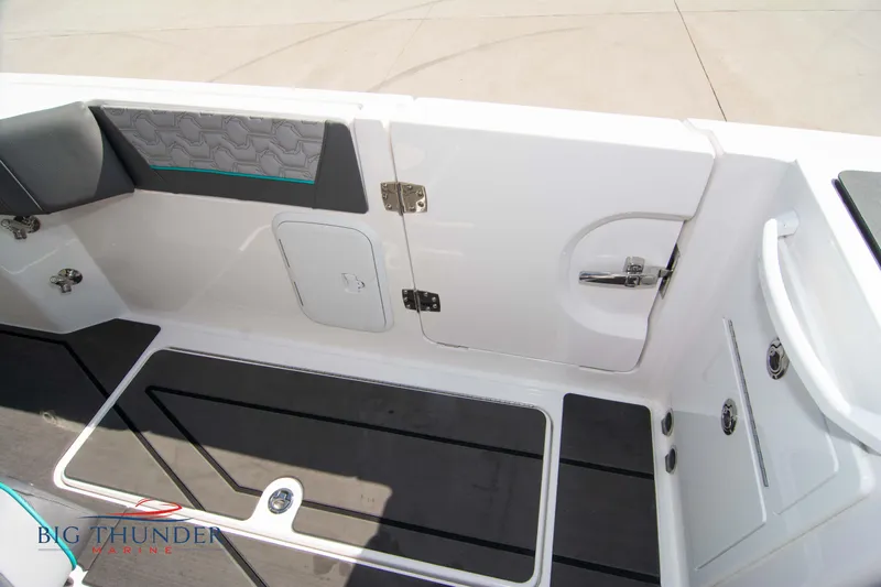  Yacht Photos Pics Interior of 2022 Fountain 32 NX with seating and storage area.