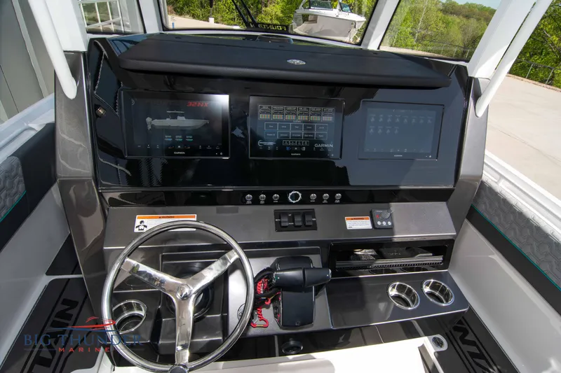  Yacht Photos Pics 2022 Fountain 32 NX cockpit with modern controls.