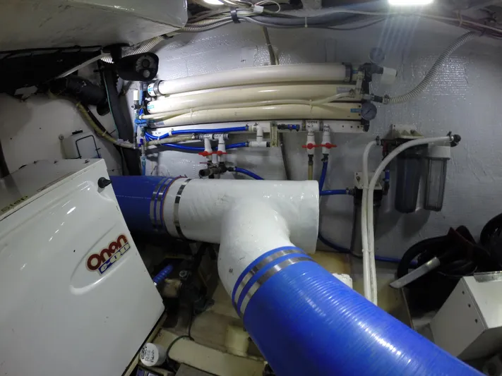 Wined Up Yacht Photos Pics Engine room of a 1973 Hatteras 53 yacht with Onan generator and plumbing system.