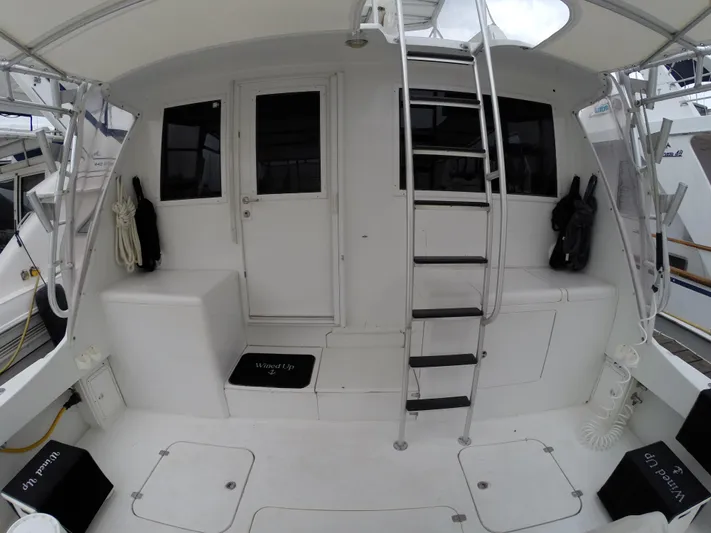 Wined Up Yacht Photos Pics 1973 Hatteras 53 yacht deck with ladder and seating area.