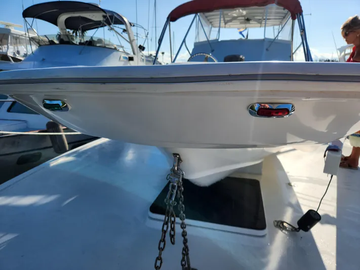 Wined Up Yacht Photos Pics 1973 Hatteras 53 yacht bow with anchor chain, docked in marina.