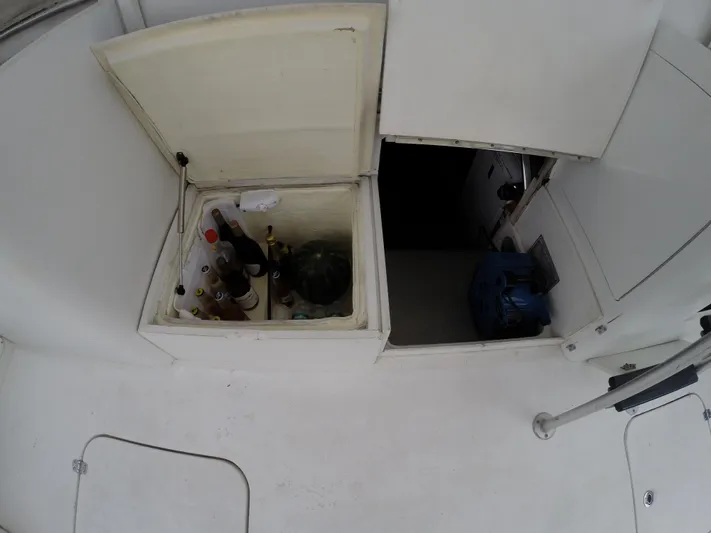 Wined Up Yacht Photos Pics 1973 Hatteras 53 yacht storage area with beverages and watermelon.