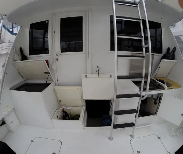 Wined Up Yacht Photos Pics 1973 Hatteras 53 yacht deck with storage compartments and ladder.