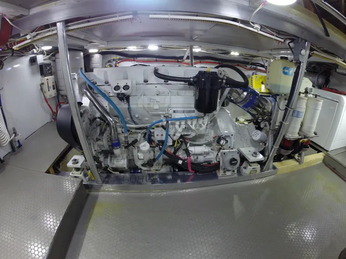 Wined Up Yacht Photos Pics Engine room of a 1973 Hatteras 53 yacht, showcasing detailed mechanical components.