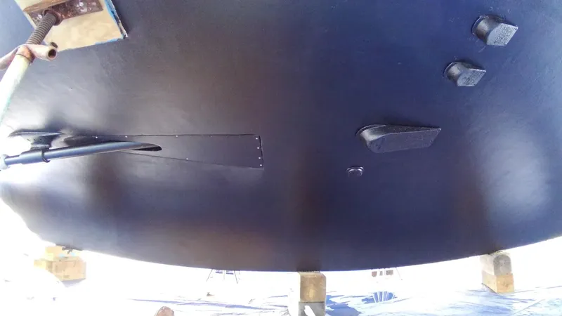 Wined Up Yacht Photos Pics Bottom view of a 1973 Hatteras 53 boat hull, showing underwater components.