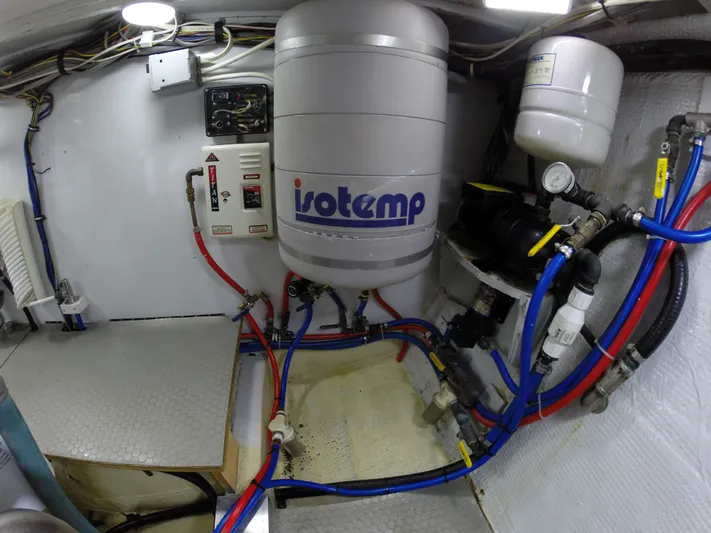 Wined Up Yacht Photos Pics Engine room of a 1973 Hatteras 53 yacht with Isotemp water heater and plumbing.