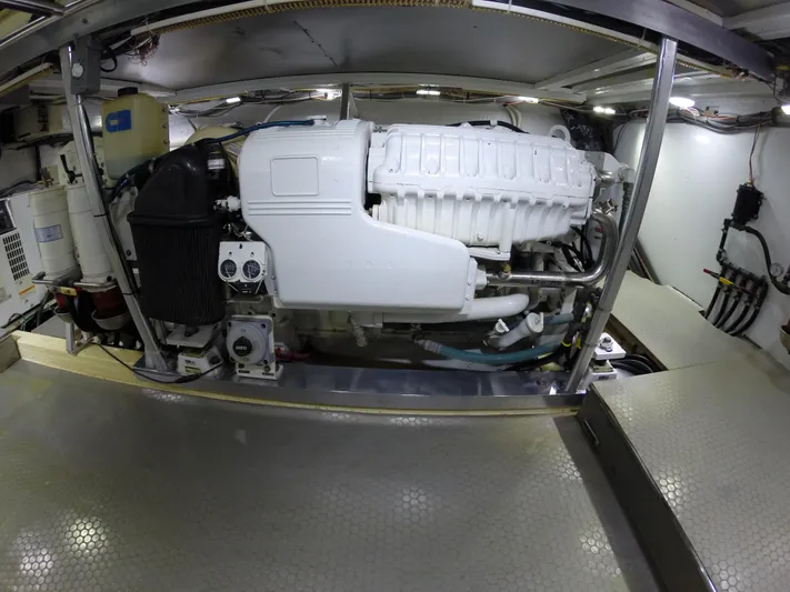 Wined Up Yacht Photos Pics Engine room of a 1973 Hatteras 53 yacht, showcasing a clean, organized setup.