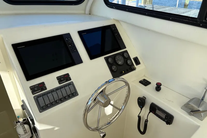  Yacht Photos Pics Helm of 2021 Composite Yacht CY32 Chesapeake with navigation screens and controls.