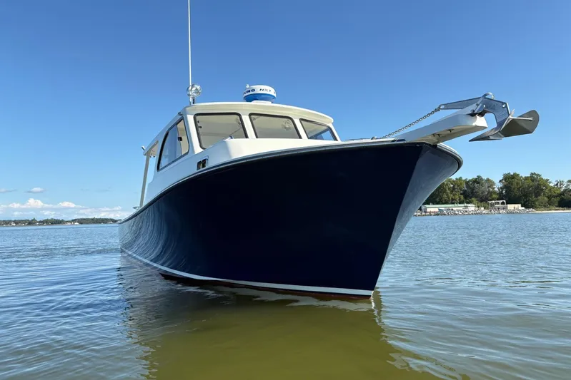  Yacht Photos Pics 2021 Composite Yacht CY32 Chesapeake on calm water under clear blue sky.