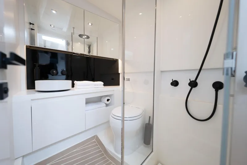  Yacht Photos Pics Luxurious bathroom interior of 2024 VanDutch 56 yacht, featuring modern fixtures and sleek design.