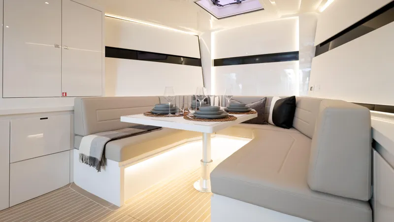  Yacht Photos Pics Luxurious interior of 2024 VanDutch 56 yacht with elegant dining area and modern design.