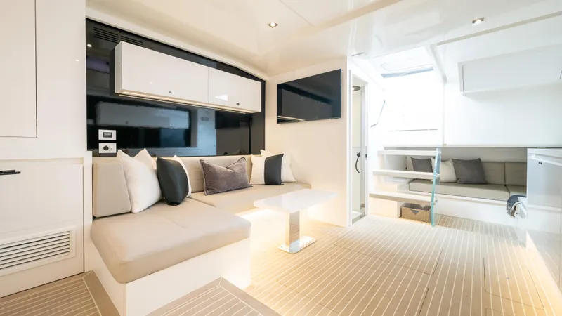  Yacht Photos Pics Luxurious interior of 2024 VanDutch 56 yacht with modern seating and elegant design.