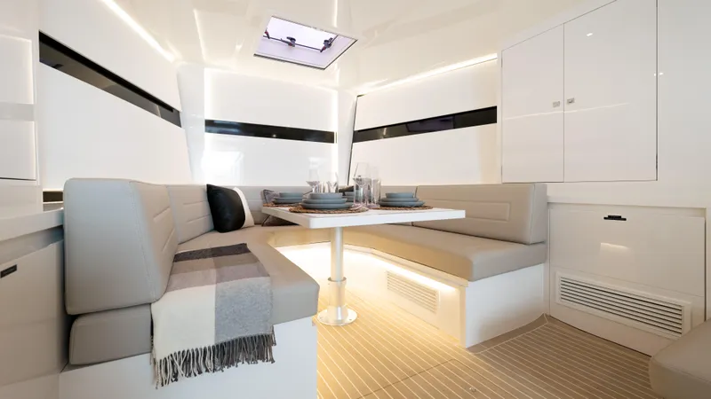  Yacht Photos Pics Luxurious interior of 2024 VanDutch 56 yacht with elegant dining area and modern design.