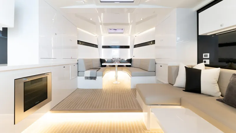  Yacht Photos Pics Luxurious interior of 2024 VanDutch 56 yacht with modern seating and ambient lighting.