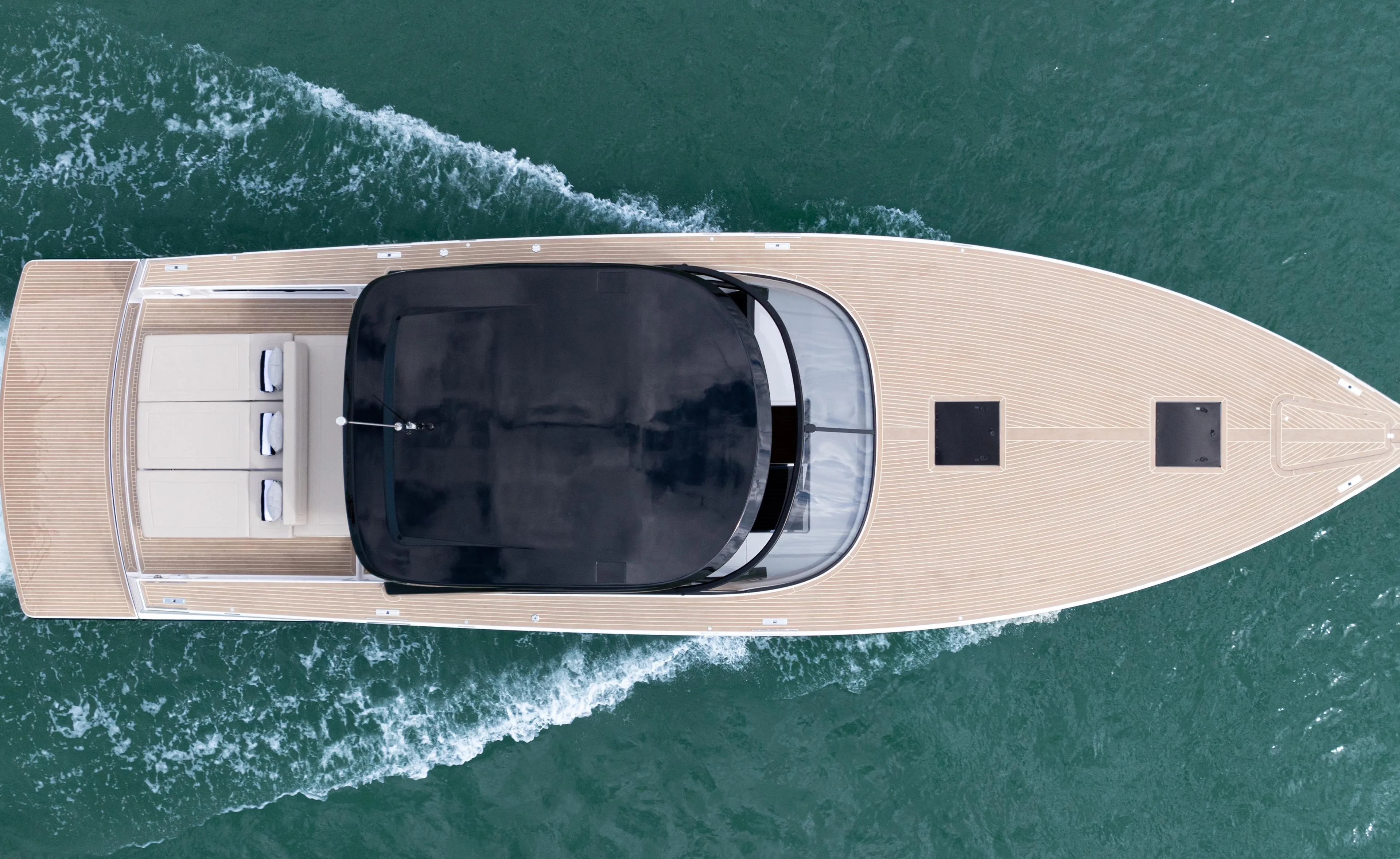 Top view of 2024 VanDutch 56 yacht cruising on water.