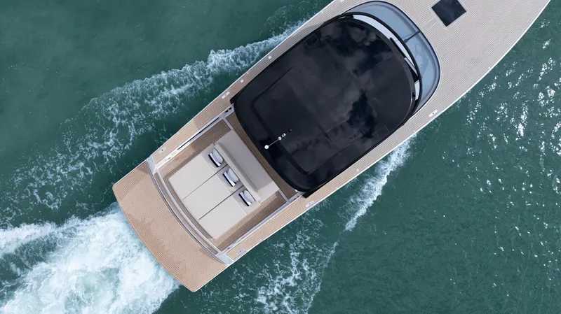  Yacht Photos Pics Aerial view of 2024 VanDutch 56 yacht cruising on water.