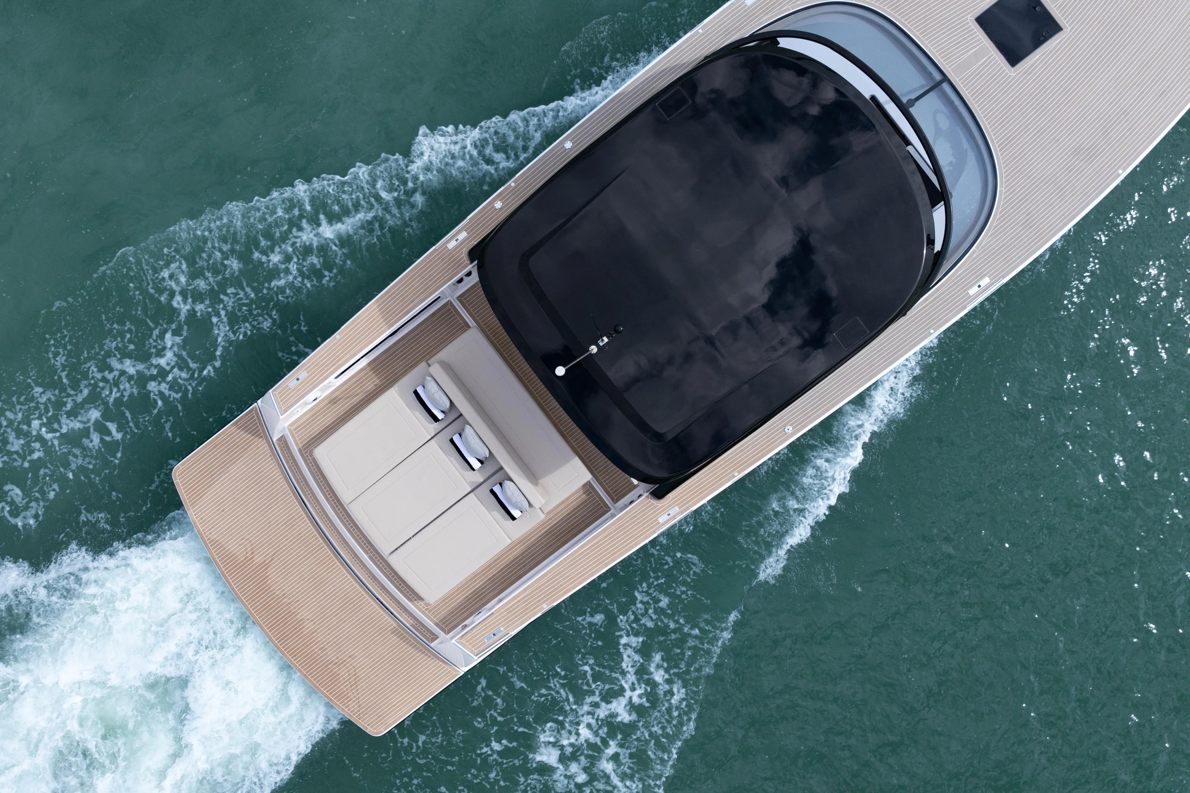 Aerial view of 2024 VanDutch 56 yacht cruising on water.