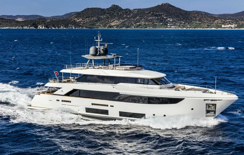  Yacht Photos Pics Luxurious 2025 Custom Line Navetta 33 yacht cruising on open sea.