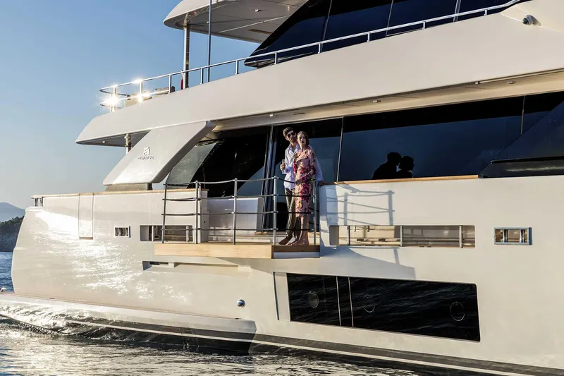  Yacht Photos Pics Luxury yacht Custom Line Navetta 33, 2025 model, with people enjoying the deck.