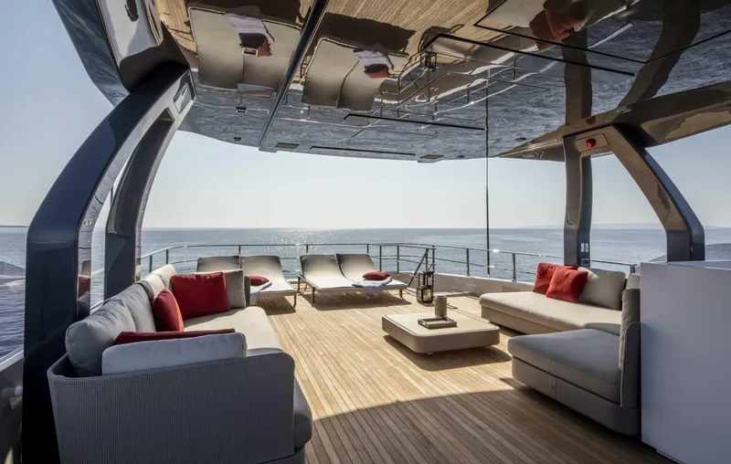  Yacht Photos Pics Luxurious 2025 Custom Line Navetta 33 yacht deck with modern seating and ocean view.