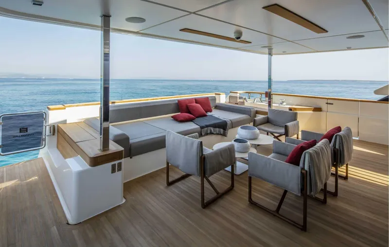  Yacht Photos Pics Luxurious 2025 Custom Line Navetta 33 yacht deck with elegant seating and ocean view.