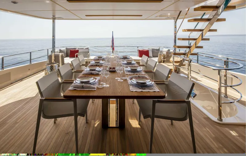  Yacht Photos Pics Luxurious dining setup on Custom Line Navetta 33 yacht, 2025 model, with ocean view.