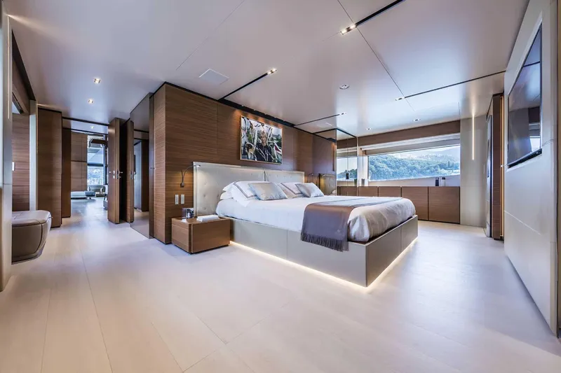  Yacht Photos Pics Luxurious bedroom interior of 2025 Custom Line Navetta 33 yacht, featuring modern design and large windows.