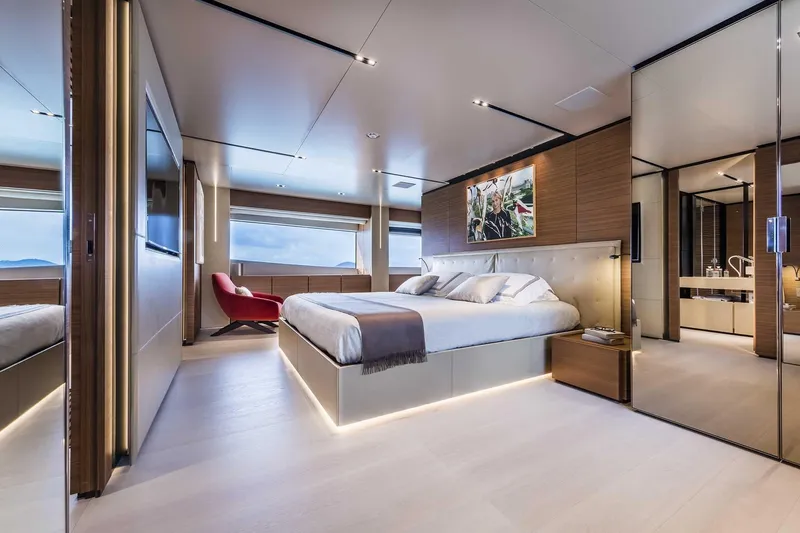  Yacht Photos Pics Luxurious bedroom interior on 2025 Custom Line Navetta 33 yacht, featuring modern design and elegant furnishings.