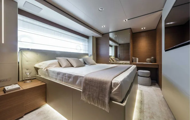  Yacht Photos Pics Luxurious bedroom interior of 2025 Custom Line Navetta 33 yacht, featuring modern design and elegant decor.