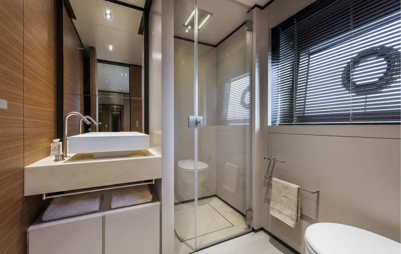  Yacht Photos Pics Luxurious bathroom on 2025 Custom Line Navetta 33 yacht, featuring modern fixtures and elegant design.