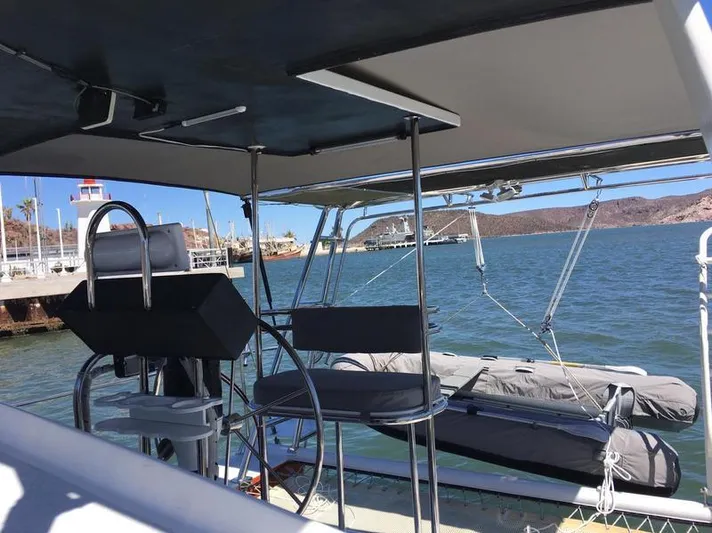 Hiolani II Yacht Photos Pics 1988 CSK Polycon boat docked at marina with clear blue water and sunny skies.
