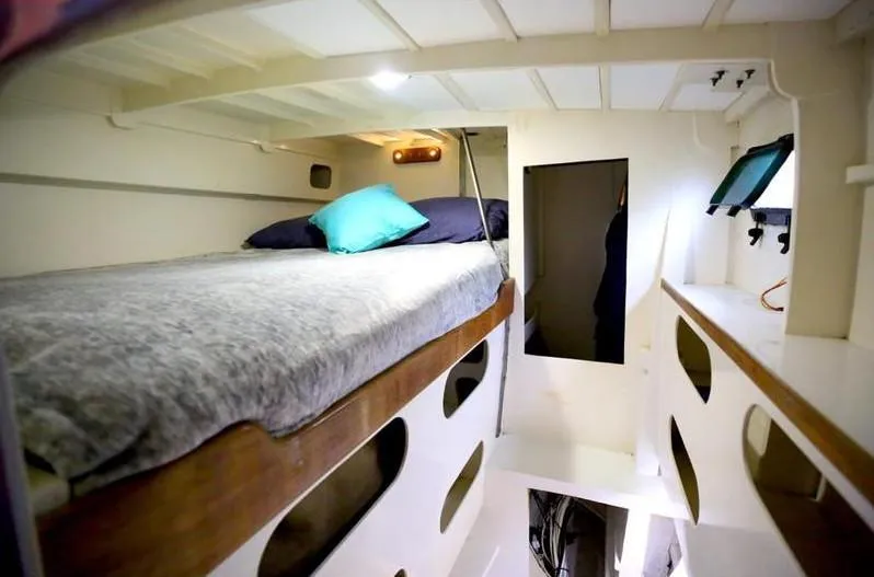 Hiolani II Yacht Photos Pics Cozy 1988 CSK Polycon boat interior with bunk bed and modern lighting.